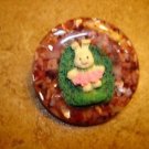 Large faux tortoise shell button with Easter bunny.