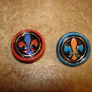Two nicely painted silver metal buttons with Celtic sign.
