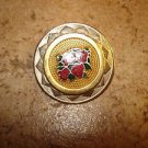 Large vintage metal button with red roses.