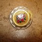 Large vintage metal button with red roses.