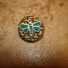 Gold metal button with dragonfly.