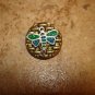Gold metal button with dragonfly.