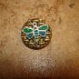 Gold metal button with dragonfly.