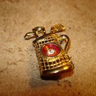 Gold tone metal button golf clubs, bag and rhinestone.