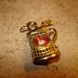 Gold tone metal button golf clubs, bag and rhinestone.