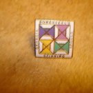 Georgia Bonesteel's Spinning Spools metal pin badge.