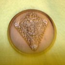 Large vintage metal button with flowers in metal triangle.