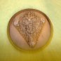 Large vintage metal button with flowers in metal triangle.
