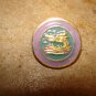 Metal button with Chinese dragon.