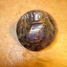 Old mother of pearl button with cash register.