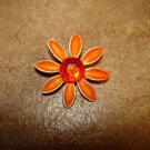 Metal flower button with large red rhinestone. Metal flower button with large red rhinestone.