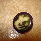 Mother of pearl button with Chinese fish.