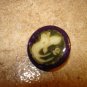Mother of pearl button with Chinese fish.