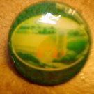 Large plastic button with country barn picture.