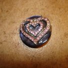 Old blue mother of pearl button with heart and pink rhinestones. Old blue mother of pearl button with heart and pink rhinestones.