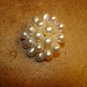 Metal button with tier shape pearls.
