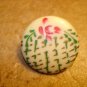 Large plastic button with Japanese style paintings.
