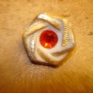 Nicely carved plastic button with red rhinestone. Nicely carved plastic button with red rhinestone.
