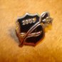 All metal pin badge 2005 with rose.