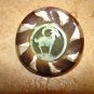 Large plastic button with goat ram.
