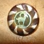 Large plastic button with goat ram.