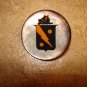Mother of pearl button with Spanish erb.