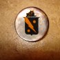 Mother of pearl button with Spanish erb.