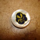 Mother of pearl button with yellow bee.