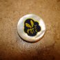 Mother of pearl button with yellow bee.