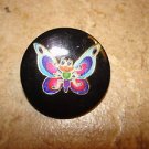 Large plastic button with colorful butterfly. Large plastic button with colorful butterfly.