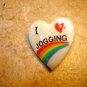 Heart shape ceramic button I love jogging with rainbow.