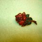 Gold metal cloisonne rose pin back pin.
