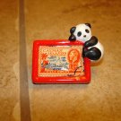 Chinese Panda bear with Cayman Island stamp button. Chinese Panda bear with Cayman Island stamp button.