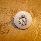 Mother of pearl button with rifle and eagle.