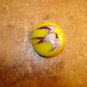 Plastic yellow button with sparrow bird.