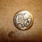 Old silver metal button with elephant.