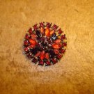 Vintage metal button with beautiful red & purple rhinestones. Vintage metal button with beautiful red & purple rhinestones.