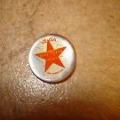Small mother of pearl button with Vega Los Angeles star.