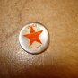 Small mother of pearl button with Vega Los Angeles star.