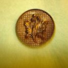 Large antique picture button with holly branch.
