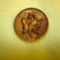 Large antique picture button with holly branch.