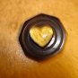 Plastic button with heart shape watch.