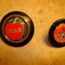 Lot of 2 advertising plastic buttons for NCAE and Barneveld.