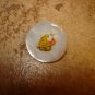 Mother of pearl button with orange cat.
