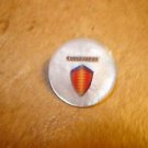 Mother of pearl button with Koenigsegg car sign.