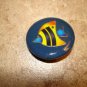 Large plastic button with colorful tropical fish.