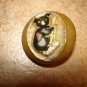 Large plastic button with metal coala bear.