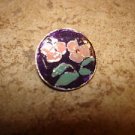 Signed silver metal button with pink flower.