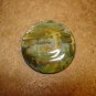Large mother of pearl button with lighthouse scene.
