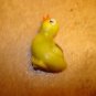 Plastic yellow chicken button with brown wing.